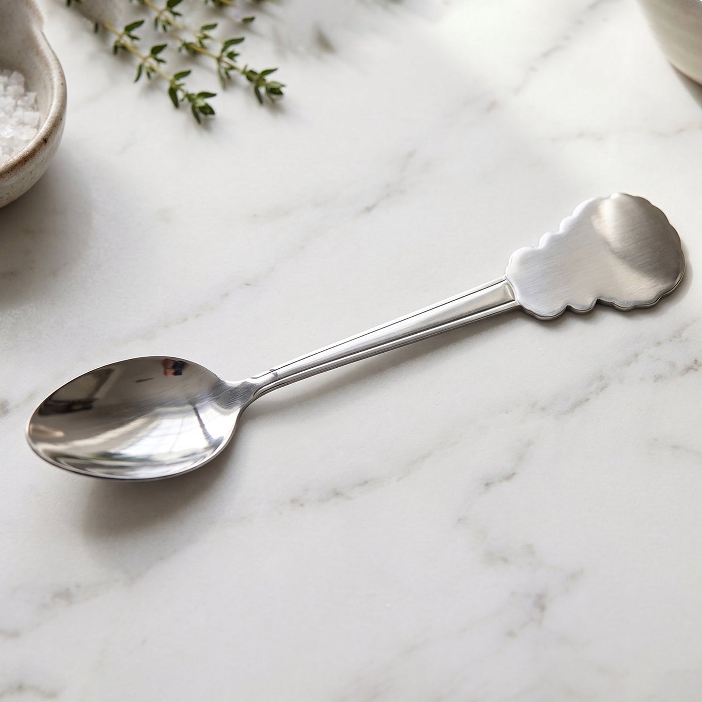 Versatile stainless steel carved handle dinner spoon for home and restaurant dining.