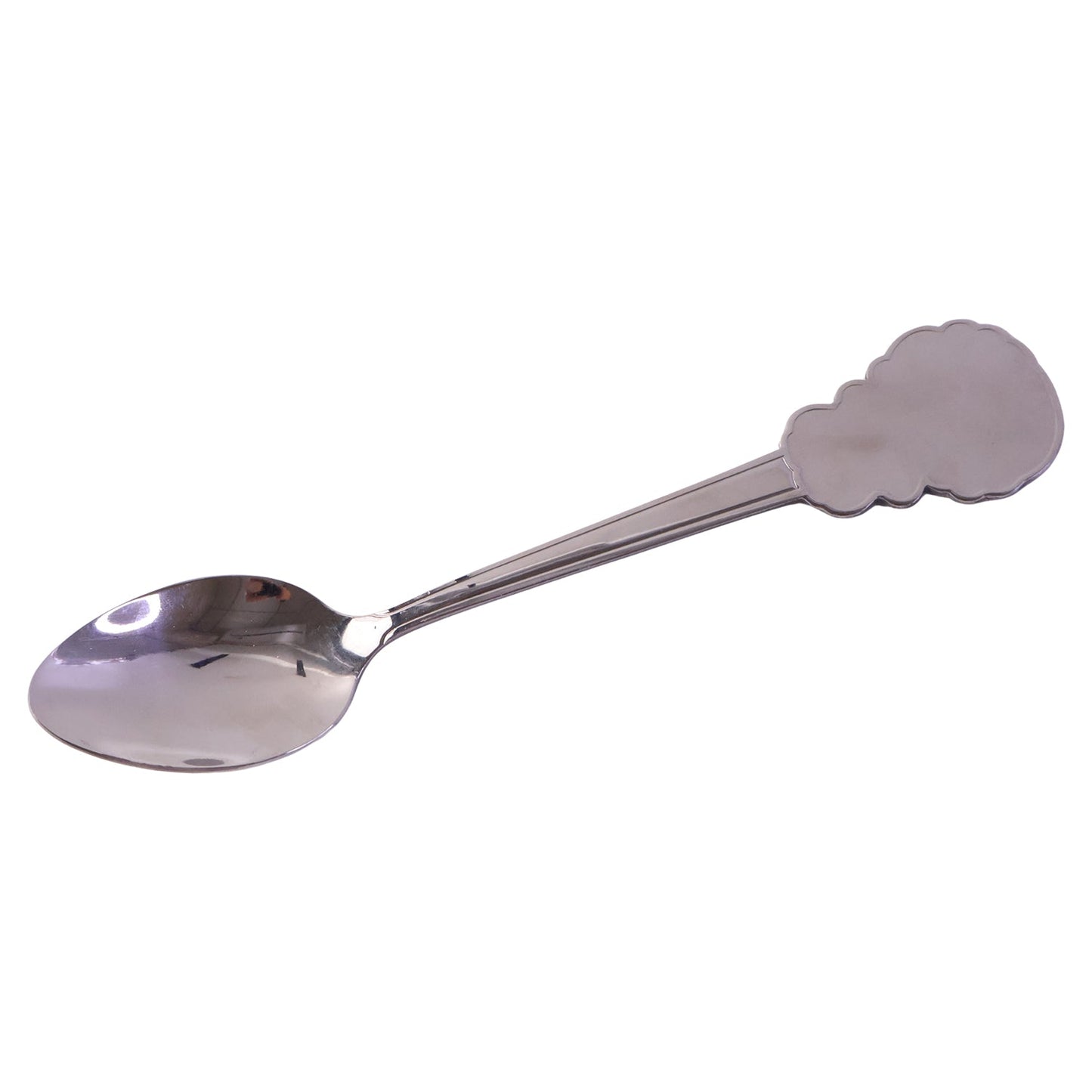 Studio shot of a stainless steel carved handle dinner spoon highlighting intricate design.