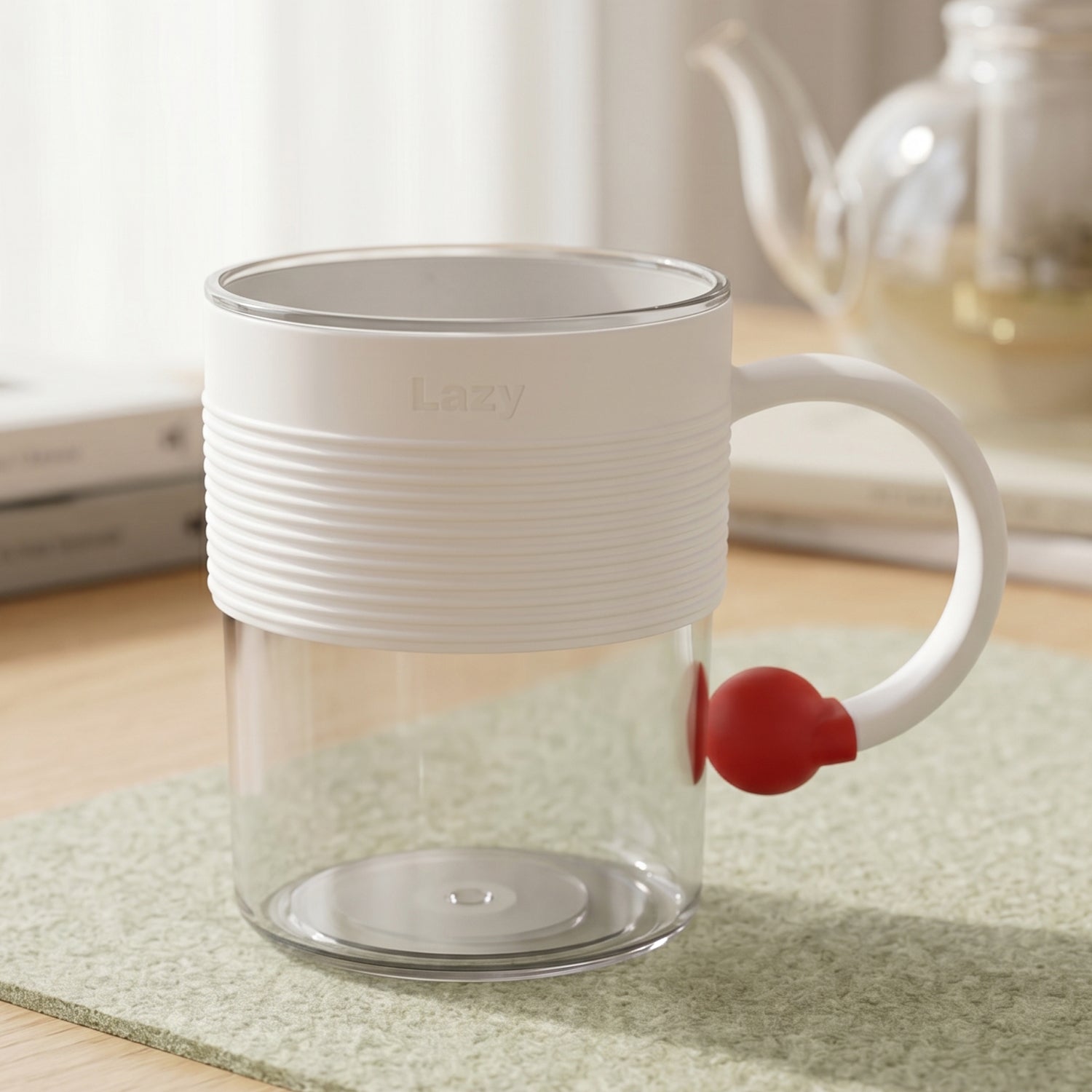 Close up view of the transparent plastic coffee mug with a red accent handle.
