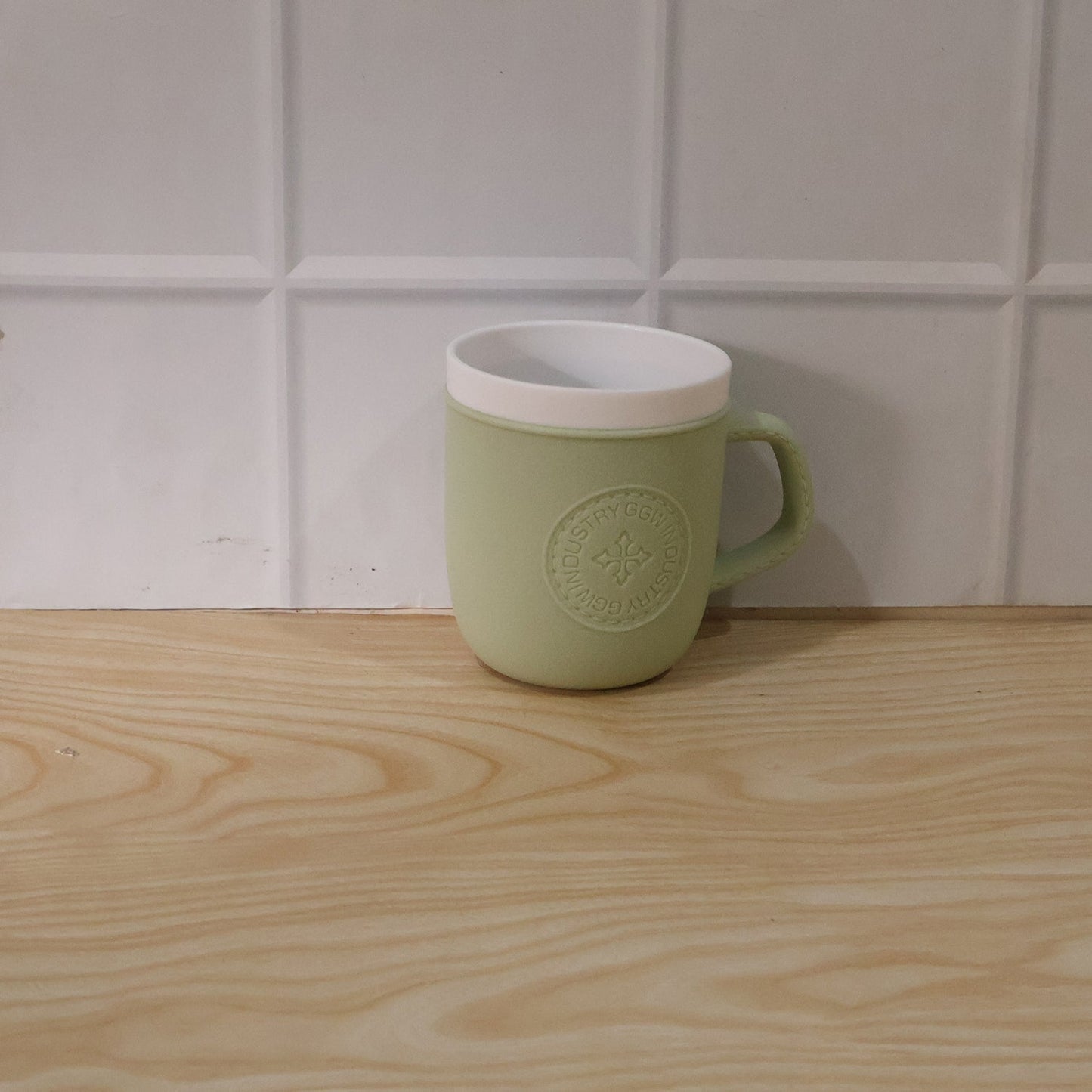 Close-up detail of the textured leather finish on the plastic mug