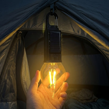 Outdoor campsite illuminated by solar camping lantern