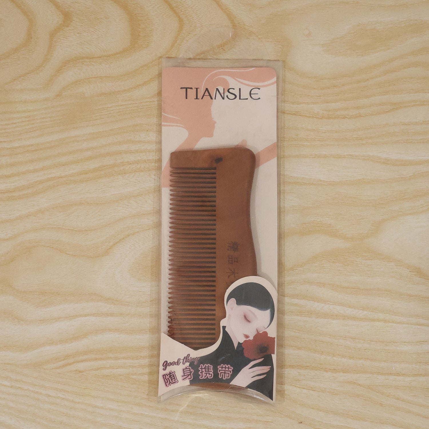 Beautiful wooden comb in packaging, ideal gift for hair care enthusiasts