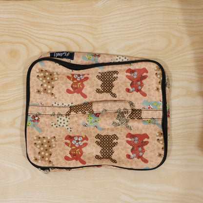 Person holding a compact travel organizer bag, ready for daily use.