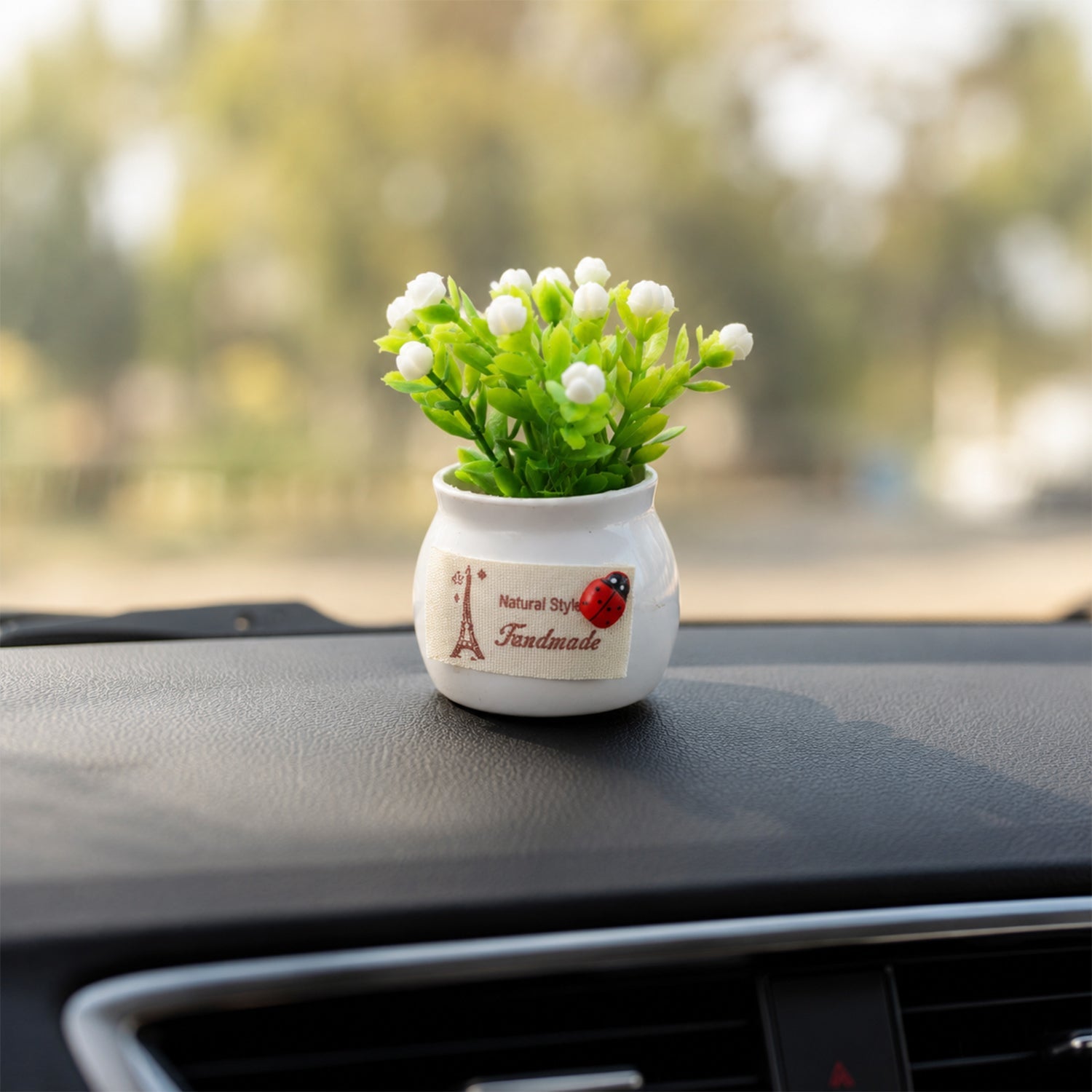 Faux flower plant in ceramic pot for living room and study