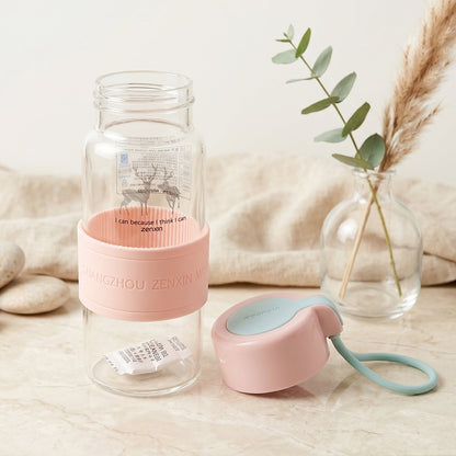 Portable glass bottle with silicone grip sleeve for daily use