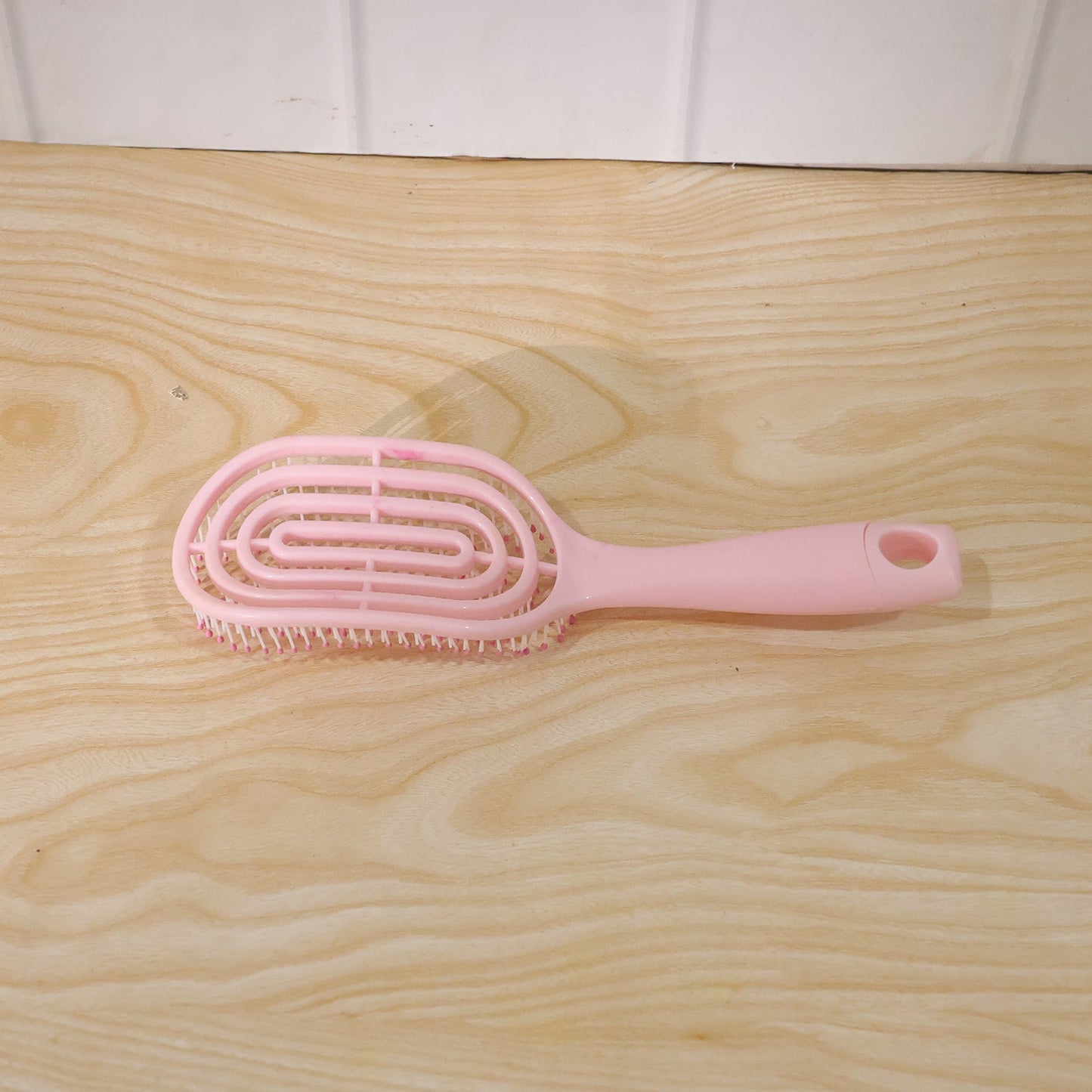 Vented design of the hair brush assisting in faster blow-drying.