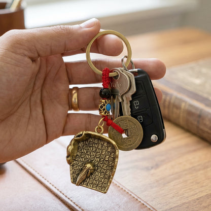 Hanging Feng Shui lucky coin keychain on bag