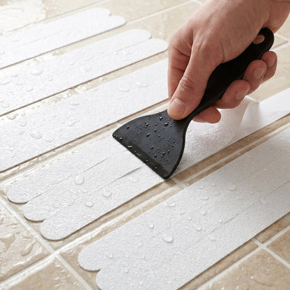 Easy-to-apply transparent bath safety strips with scraper tool