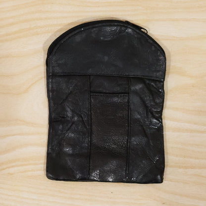 Laying down the black leather mini pouch with its slim profile. Swipeable.