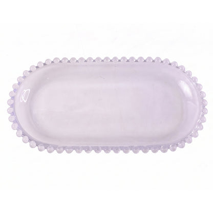 Transparent oval glass tray for serving snacks and sweets