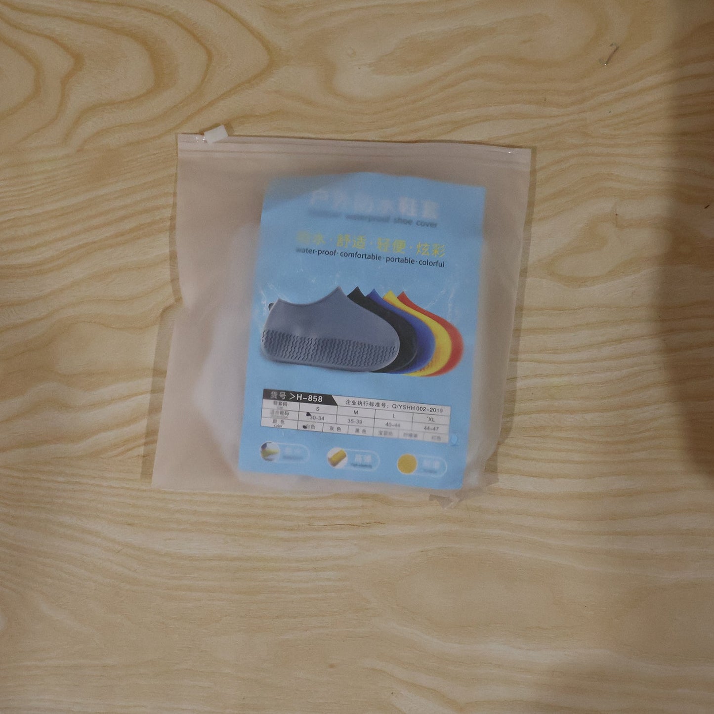Small white waterproof silicone rain shoe cover in a daily use scenario.