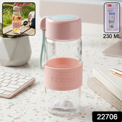 Compact glass water bottle with protective silicone sleeve for travel